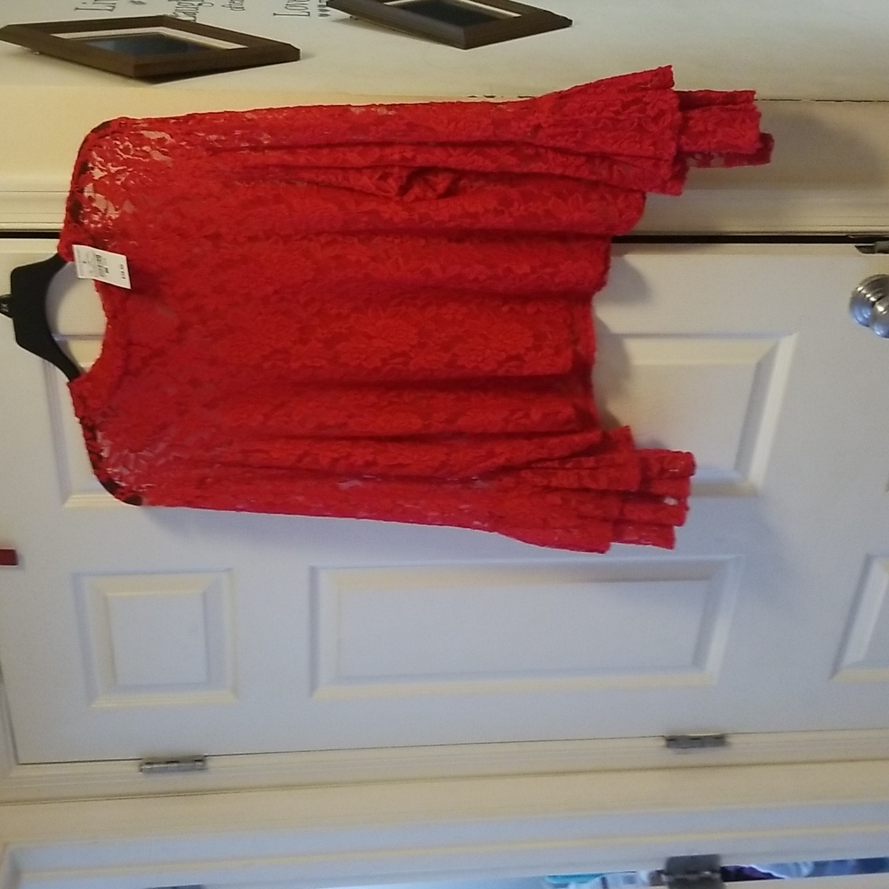 Red lace top with butterfly arms near the hands